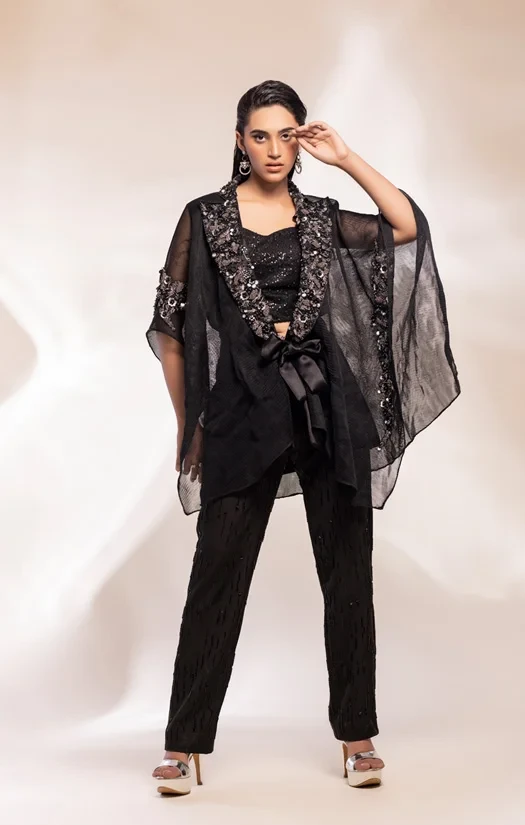 Black kaftan jacket, camisole and trouser.